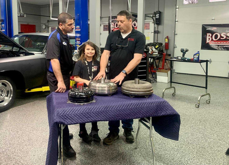 Boss Hog team inspecting a torque converter in the shop