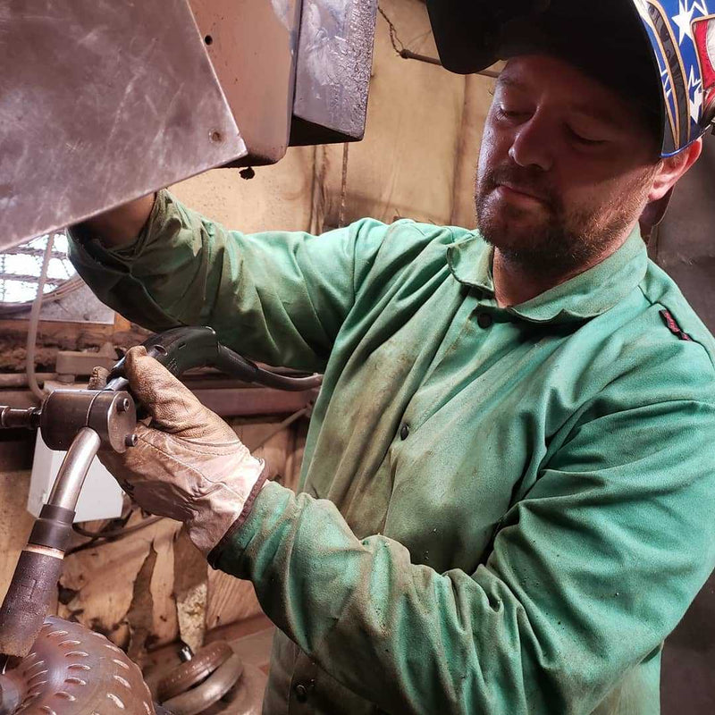 Welder assembling a torque converter