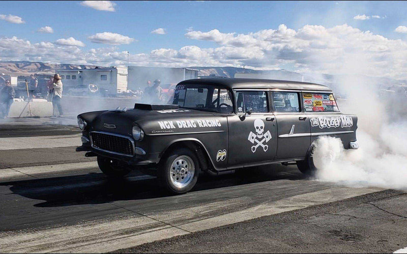 Chevrolet wagon doing a burnout at the drag strip